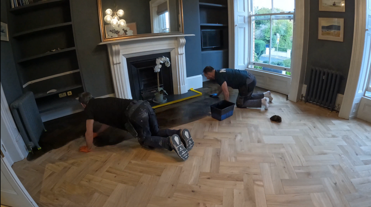 The Kidd Flooring team fitting an oak herringbone floor in a period home