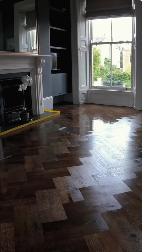 Damaged engineered oak floor patched with matched boards, then sanded and refinished by Kidd Flooring