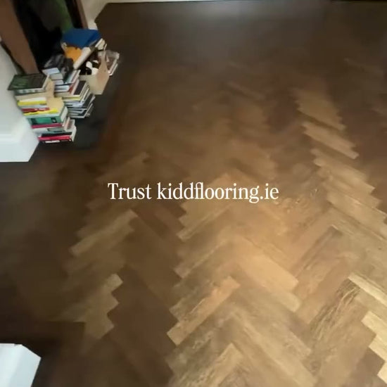 Worn oak herringbone sanded and refinished by Kidd Flooring in Loba Jacobean stain and 2K Duo lacquer