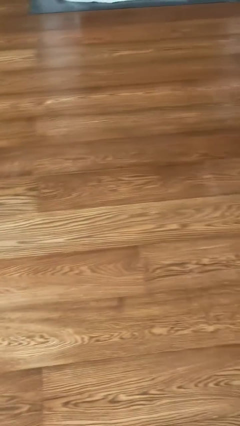 Raw oak floor laid over new insulation and stained in Loba Jacobean by Kidd Flooring