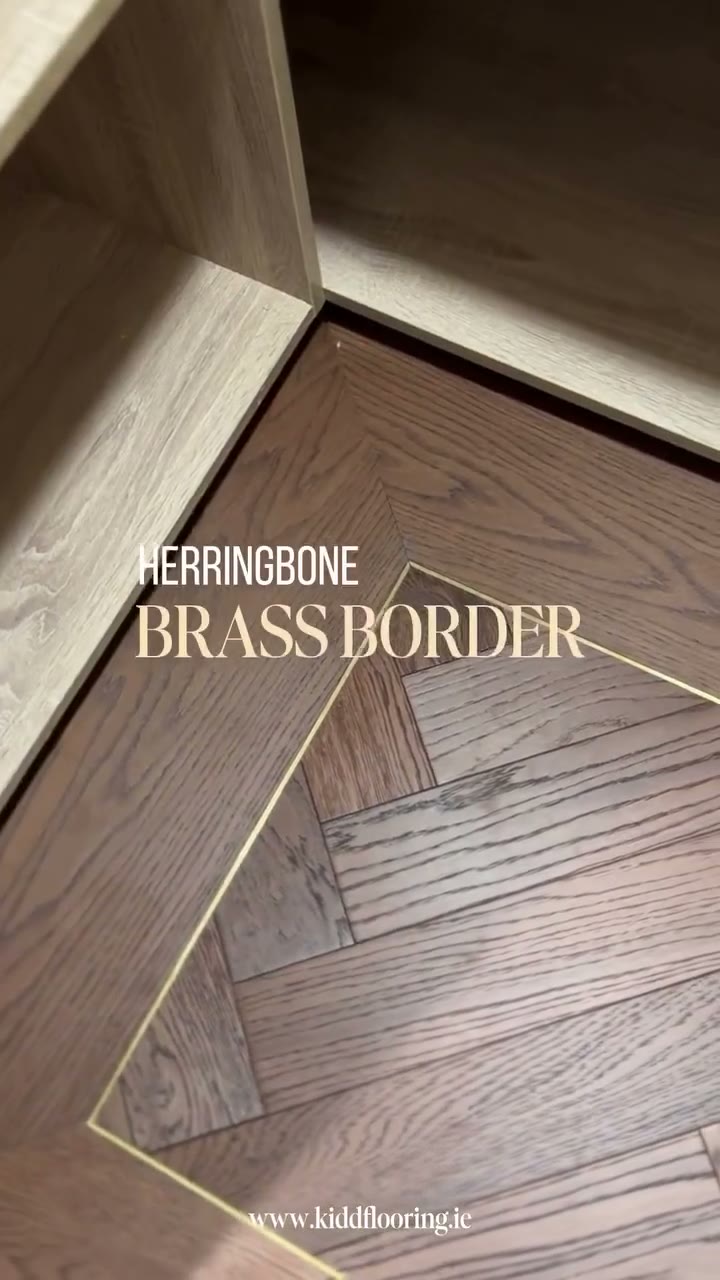 Mountain Deep Smoked Oak herringbone with a plank border and brass inlay, fitted by Kidd Flooring