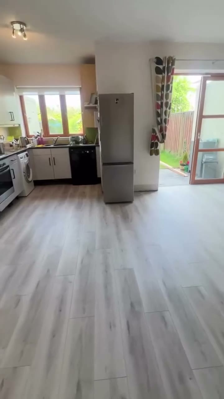 Orchid Oak SPC fitted by Kidd Flooring in place of old floor tiles